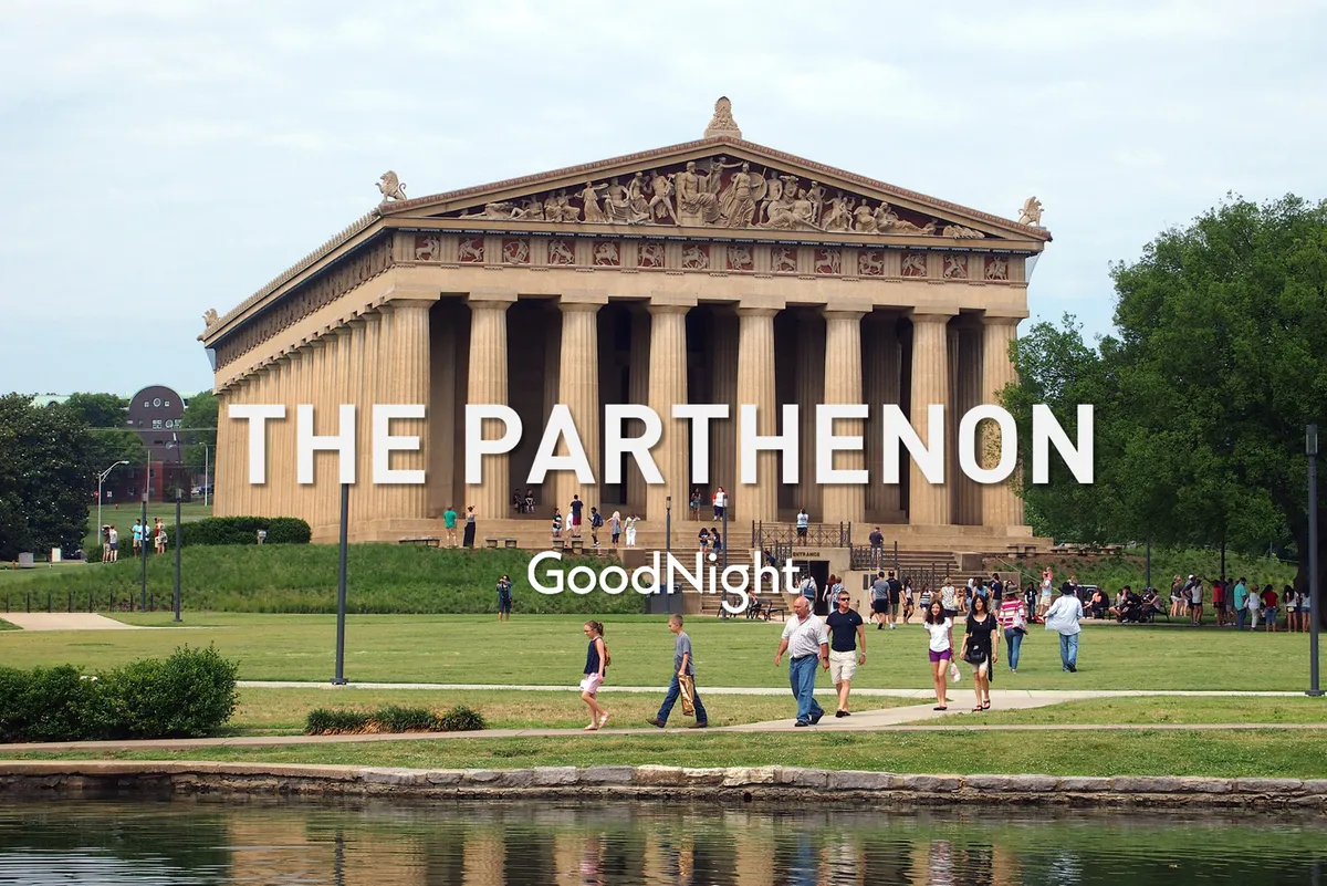A lively scene at Centennial Park, featuring the iconic Parthenon surrounded by lush green grass, visitors strolling, and a reflective water surface that adds to the park’s vibrant atmosphere. The image captures people engaging in sightseeing, photography, and leisurely walks.