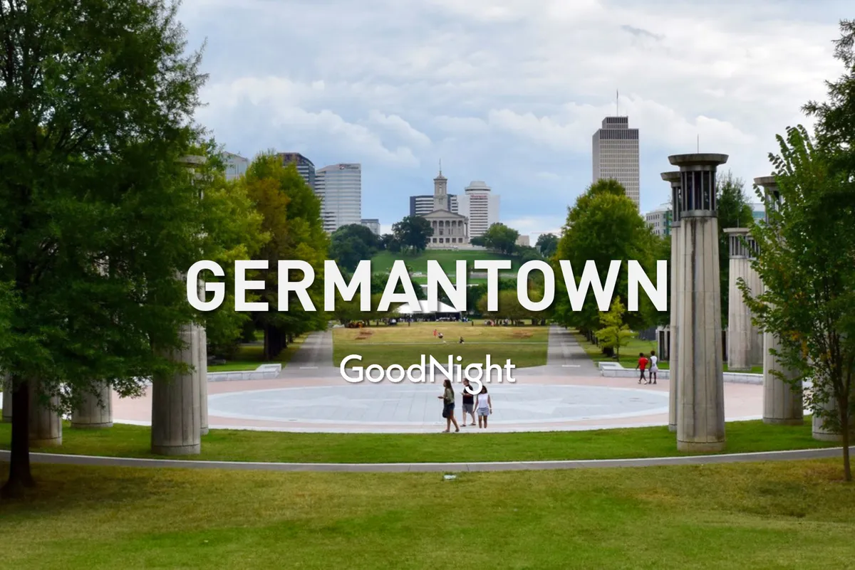 A wide, open green space with people walking and gathering, set against the backdrop of the Nashville city skyline. The area is tranquil and inviting, ideal for strolling, picnicking, and enjoying outdoor activities.